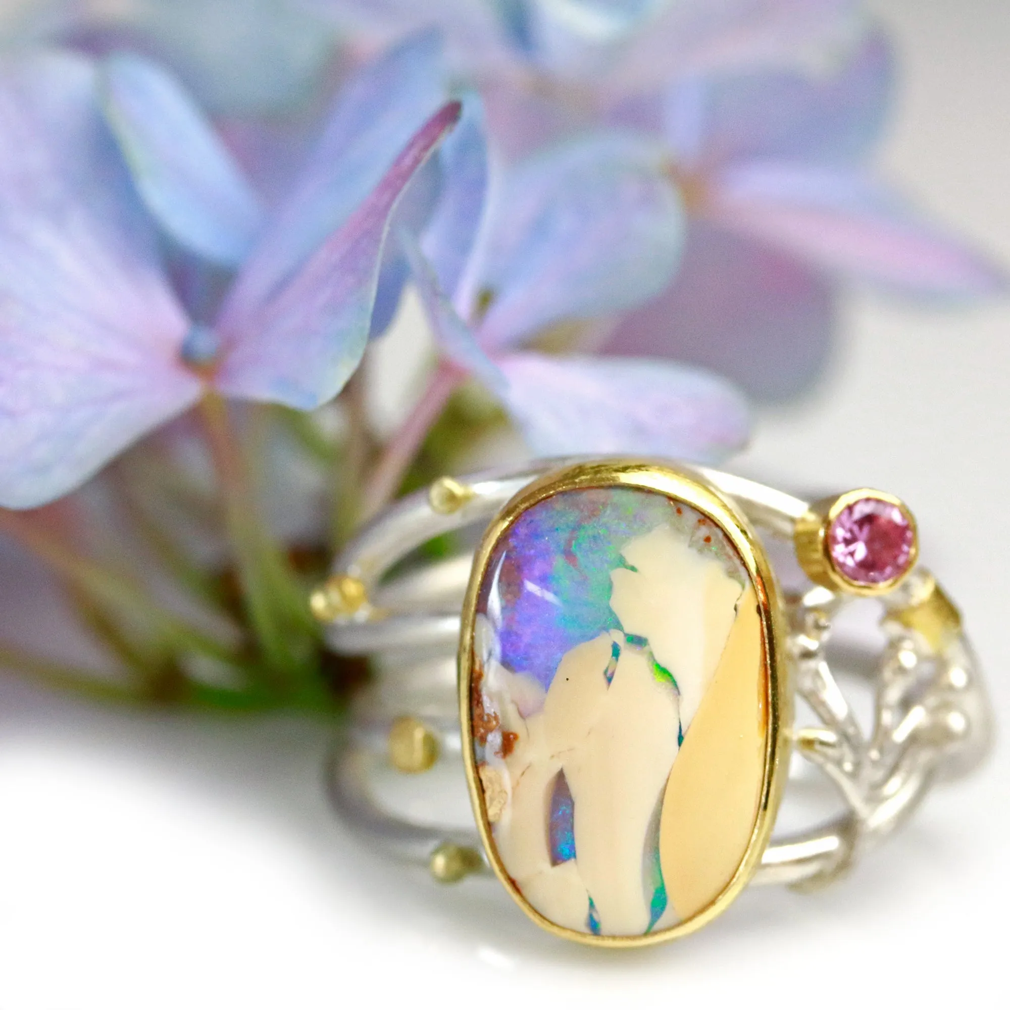 SOLD  Boulder Opal and Pink Sapphire on Swirled Band Ring. Size 6 3/4.