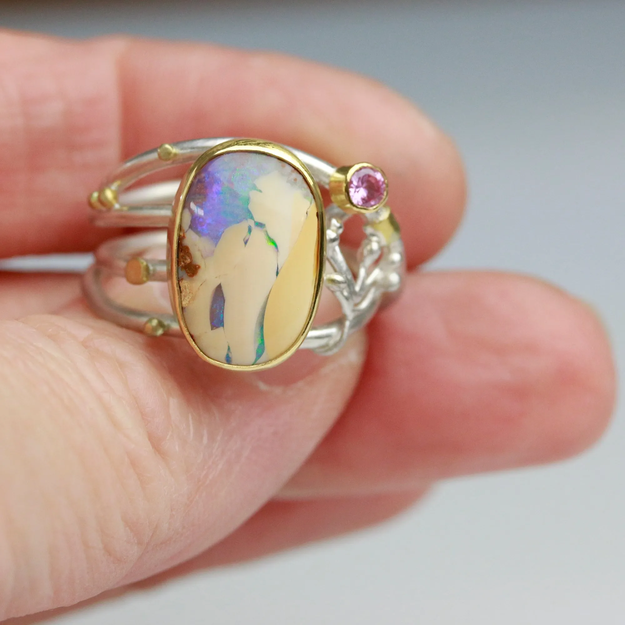 SOLD  Boulder Opal and Pink Sapphire on Swirled Band Ring. Size 6 3/4.
